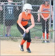  ??  ?? Tigers’ Emma Hacker watches a base hit go through the infield.
