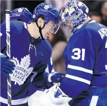  ?? FRANK GUNN / THE CANADIAN PRESS ?? Toronto’s James van Riemsdyk, who scored the winning shootout goal, congratula­tes goaltender Frederik Andersen after beating the Nashville Predators.