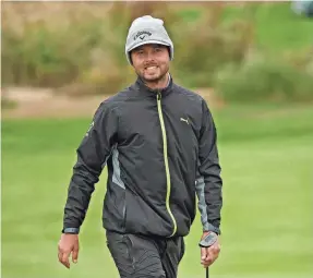  ?? CLIFF HAWKINS/GETTY IMAGES ?? Adam Svensson of Canada reacts on the 18th green Sunday after winning the RSM Classic and earning an invitation to the Masters.