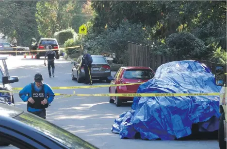  ?? BOB MAKIN/ SPECIAL TO THE SUN/ FILES ?? Peng Sun’s body was found in a vehicle on Wellington Drive in North Vancouver in September 2015. A BMW, a Bentley and a Chevrolet Malibu were hauled from the scene. Only the Bentley had a tarp placed over it, leading residents to suspect the victim was...