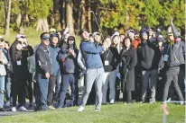  ?? PARK JI-HO/YONHAP VIA AP ?? Brooks Koepka watches his shot on the 10th hole during the first round of the CJ Cup on Saturday at Nine Bridges on Jeju Island, South Korea. Koepka improved his chance at gaining the No. 1 world ranking.
