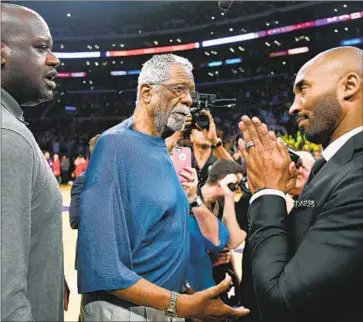  ?? Wally Skalij Los Angeles Times ?? KOBE BRYANT pays respect to Bill Russell, center, next to Shaquille O’Neal, during Bryant’s jersey retirement ceremony in 2017. Russell always got a standing ovation during his visits to the former Staples Center.
