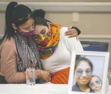  ?? LIAM RICHARDS / THE CANADIAN PRESS FILES ?? Kyla Frenchman, right, mother of Tanner Brass, is comforted by her sister during a media event in 2022.