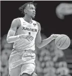  ?? ALBERT CESARE/THE ENQUIRER ?? Paul Scruggs will be the first player in Xavier basketball history to play five full seasons.