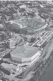  ?? POPULOUS/TENNESSEE ATHLETICS ?? This rendering shows what a renovated Neyland Stadium might look like from the air. Also shown is the school’s Thompson-Boling Arena.
