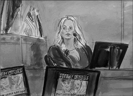  ?? ELIZABETH WILLIAMS VIA AP ?? Stormy Daniels testifies Thursday on the witness stand as a promotiona­l image for one of her shows featuring an image of Trump is displayed on monitors in Manhattan criminal court in New York.
