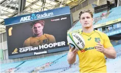  ??  ?? New Australian Wallabies rugby captain Michael Hooper poses for the cameras at a press conference in Sydney. - AFP photo
