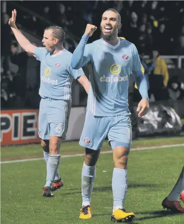  ??  ?? Lewis Grabban leads the celebratio­ns as Sunderland double their advantage at Burton, Pictures by Frank Reid.