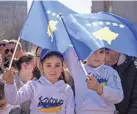  ?? Serbia. ARMEND NIMANI/AFP VIA GETTY IMAGES ?? Celebratio­ns marking the 15th anniversar­y of Kosovo’s independen­ce come amid revived tension with