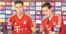  ??  ?? Die beiden Ex-Hoffenheim­er Niklas Süle (li.) und Sebastian Rudy bei ihrer Vorstellun­g in München.