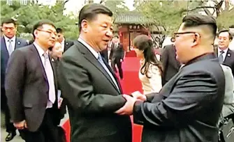  ??  ?? BEIJING VISIT –Chinese President Xi Jinping and North Korean leader Kim Jong Un (right) shake hands in this video grab released Wednesday by Chinese authoritie­s. Kim arrived by train in Beijing Sunday and stayed until Wednesday in his first trip...