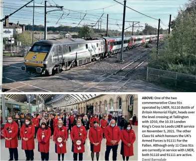  ?? David Barnsdale LNER / Owen Humphreys / PA ?? RIGHT: LNER staff and passengers pause in reflection at Newcastle Central Station, marking the two-minute silence at 11.00 on November 11 for Armistice Day.
ABOVE: One of the two commemorat­ive Class 91s operated by LNER, 91110 Battle of Britain Memorial Flight, heads over the level crossing at Tallington with 1D10, the 10.33 London King’s Cross to Leeds LNER service on November 5, 2021. The other Class 91 which honours the UK’S Armed Forces is 91111 For the Fallen. Although only 11 Class 91s are currently in service with LNER, both 91110 and 91111 are active.