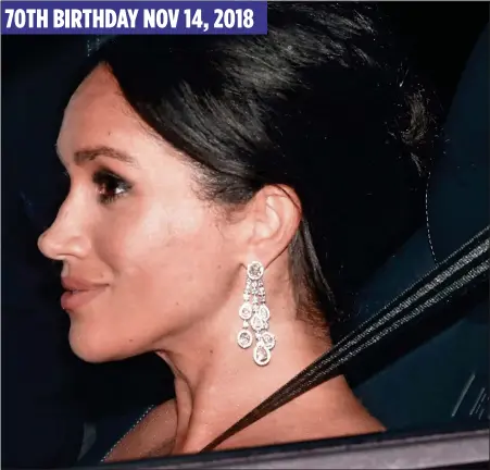  ??  ?? SECOND OUTING: The Duchess wore the controvers­ial earrings again on her father-in-law’s 70th birthday