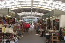  ??  ?? Visitors can find African-themed items, including drums, baskets and clothing, at the Malcolm Shabazz African Market.