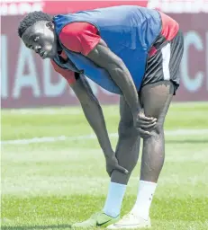  ?? PAUL CHIASSON/THE CANADIAN PRESS ?? Canada’s Alphonso Davies stretches during a practice in Montreal. The Vancouver Whitecaps’ rising star Davies headlines a young Canadian squad for the 2017 CONCACAF Gold Cup.
