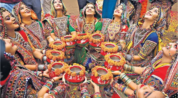  ?? ?? Higher calling: folk dancers rehearse ahead of the Hindu festival of Navratri, during which the goddess Durga is worshipped. The festival takes place in Ahmedabad, the largest city in India’s Gujarat state