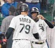  ?? CHARLES REX ARBOGAST/ASSOCIATED PRESS ?? Chicago White Sox’s Jose Abreu (79) celebrates with Tim Anderson after the pair scored on Abreu’s two-run home run Tuesday against Boston.