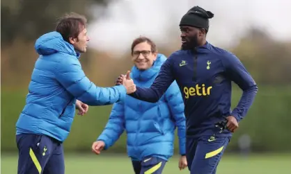  ?? ?? Tottenham’s manager Antonio Conte greets Tanguy Ndombele at training. Photograph: Tottenham Hotspur FC/Getty Images