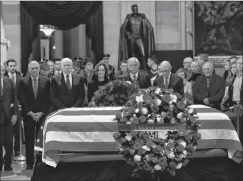  ?? AP PHOTO ?? CIA Director Gina Haspel together with former CIA Directors, from left, William Webster, George Tenet, John Brennan, Haspel, Porter Goss and James Woolsey, pay their last respect to former President George H.W. Bush as he lie in state at the U.S. Capitol in Washington, Tuesday.