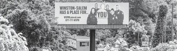  ?? CLARK HODGIN/THE NEW YORK TIMES PHOTOS ?? A billboard outside Asheville, North Carolina, calls for police to join the force in Winston-Salem, about 150 miles to the east. A survey of almost 200 police department­s indicated that police retirement­s and resignatio­ns rose sharply from April 2020 to April 2021. Asheville’s police force is down more than a third from 238.
