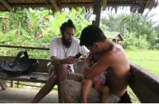  ?? Manvir Singh, via © The New York Times Co. ?? Manvir Singh, an anthropolo­gist and an author on the new study, records speech in southern Siberut, Indonesia, in 2017.