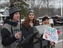  ?? ERIC BONZAR — THE MORNING JOURNAL ?? Avon Lake High School sophomore Daniel Gray, 16, speaks out against gun violence in schools March 9, during a walkout at the school alongside classmates Olivia Mercio, 16, center, and Allison Yellets, 17.