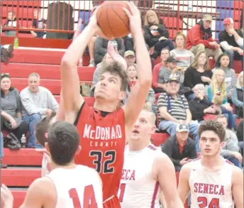  ?? RICK PECK/SPECIAL TO MCDONALD COUNTY PRESS ?? McDonald County’s Cade Smith scores two of his 14 points in the Mustangs’ 63-59 win on Jan. 17 at Seneca High School.