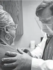  ?? PROVIDE BY HEARTS THAT CARE VOLUNTEER HEALTH CLINIC ?? Dr. Daniel Joyce examines a patient at Hearts That Care Volunteer Health Clinic. Hearts That Care received a $10,000 grant through Gannett’s A Community Thrives initiative.