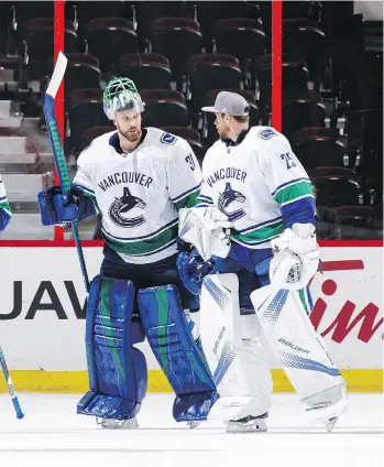  ?? GETTY IMAGES/FILES ?? Anders Nilsson and Jacob Markstrom have put up similar numbers tending goal for the Vancouver Canucks this season and say goalie coach Dan Cloutier does a good job preparing them for game day.