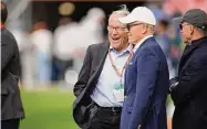  ?? David Zalubowski/Associated Press ?? Denver Broncos owner Rob Walton, left, chats with New York Jets chairman Robert Wood Johnson on Oct. 23 in Denver.