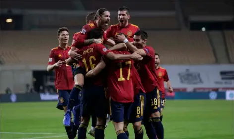  ?? AP Photo/Miguel Morenati ?? Spain’s players celebrate a goal against Germany during the UEFA Nations League soccer match between Spain and Germany in Seville, Spain, on Tuesday.