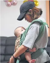  ??  ?? HOLDING ON: A woman and child at the Jusarang Church, a shelter for unwed mothers with babies.