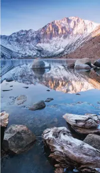  ??  ?? A COLD MORNING AT CONVICT LAKE off Highway 395 at Mammoth Lakes, right; Butterfly Beach in Santa Barbara, below; fun on the beach at Hotel del Coronado, San Diego, bottom.