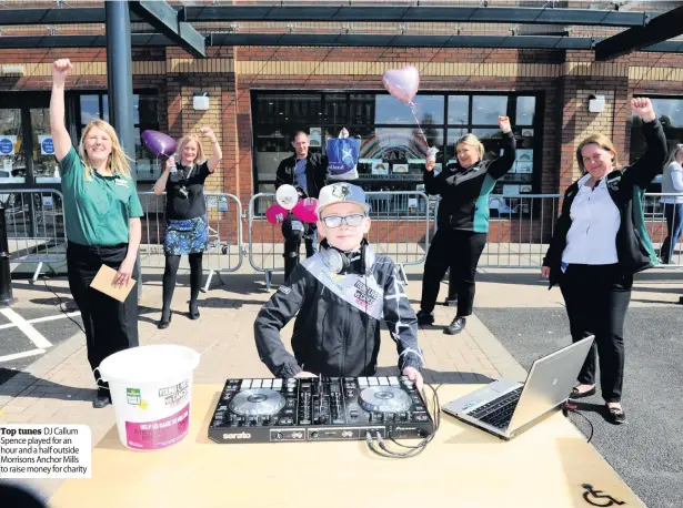  ??  ?? Top tunes DJ Callum Spence played for an hour and a half outside Morrisons Anchor Mills to raise money for charity