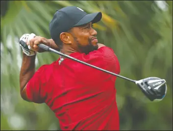  ?? — GETTY IMAGES ?? Tiger Woods plays his shot from the 13th tee during The Match: Champions For Charity last weekend. Tiger is healthy and should be a big threat this summer.