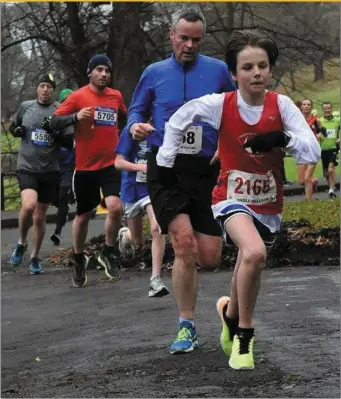  ??  ?? Liam McGreehan O’Grady of Drogheda & District AC stretches the field in the Jingle Bells 5K.