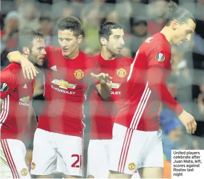  ??  ?? United players celebrate after Juan Mata, left, scores against Rostov last night