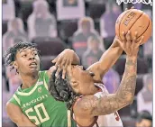  ??  ?? FAMILIAR FOE: Isaiah White and USC defeated Eric Williams (50) and Oregon,72-58 earlier this season. They meet again Sunday.