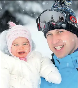  ?? Pictures: JOHN STILLWELL/ PA ?? All wrapped up... Charlotte gets a cuddle from father Prince William