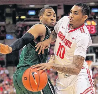  ?? ASSOCIATED PRESS FIILE PHOTO/JAY LAPRETE ?? In this Dec. 29, 2012 file photo, Chicago State’s Aaron Williams (left) defends as Ohio State’s Laquinton Ross tries to dribble past him during their NCAA college basketball game in Columbus, Ohio. Williams was the first overall selection by the St....