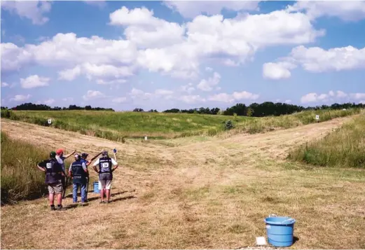  ?? PROVIDED ?? Shooters look at targets being thrown during a competitio­n at Northbrook Sports Club, which hosts the World English Sporting Championsh­ip starting Monday.