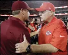  ?? CHARLIE RIEDEL — THE ASSOCIATED PRESS ?? Chiefs coach Andy Reid, right, and Redskins coach Jay Gruden shake hands after Monday’s game in Kansas City, Mo. The Chiefs won, 29-20.