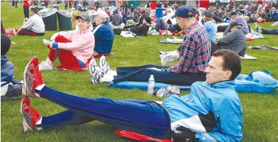  ?? The Associated Press ?? Q In this April 21, 2008, file photo, Paul Thompson of Kettering, England, stretches in the Athlete’s Village prior to the start of the 112th Boston Marathon in Hopkinton, Mass.