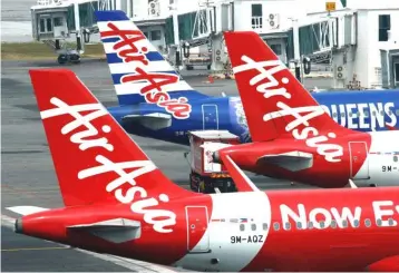  ??  ?? Higher fuel prices weighed, particular­ly on AirAsia X Bhd where they increased by around 25 per cent from a year earlier.The unit reported a second-quarter loss of RM57.5 million, reversing a profit of RM47.4 million a year earlier. — Reuters photo