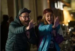  ?? Philippe Bosse ?? Seth Rogen and Charlize Theron in “Long Shot.”