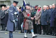  ?? PETER NICHOLLS / REUTERS ?? A piper plays at the Cenotaph to remember fallen servicemen and women, in London on Sunday.