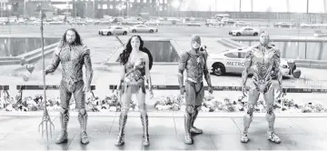  ??  ?? The members of the Justice League assemble, from left to right: Jason Momoa as Aquaman, Gal Gadot as Wonder Woman, Ezra Miller as the Flash and Ray Fisher as Cyborg. — Courtesy of Warner Bros. Pictures-DC Comics