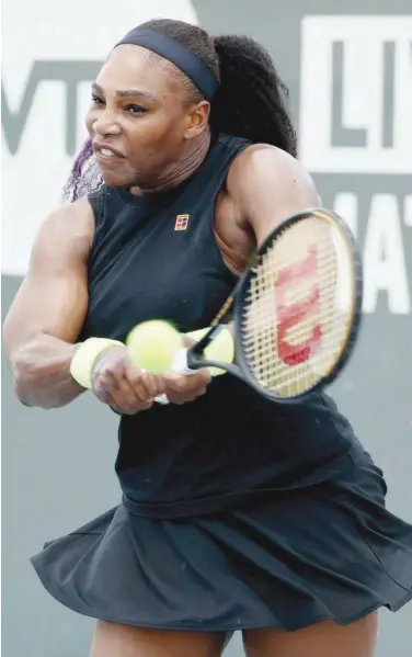  ?? Agence France-presse ?? Serena Williams plays a backhand against Venus Williams during their Top Seed Open match in Lexington on Thursday.