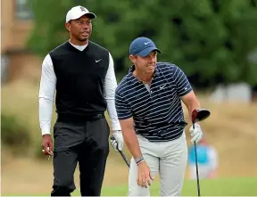 ?? GETTY IMAGES ?? Tiger Woods, left, and Rory McIlroy congratula­ted the R&A for barring Greg Norman from The 150th Open Championsh­ip at St Andrews.
