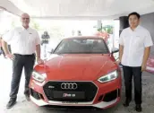  ??  ?? Audi PH head Benedicto Coyiuto (right) and Audi GmbH certified driving instructor Christoph Klapper present the new Audi RS5 Coupé.